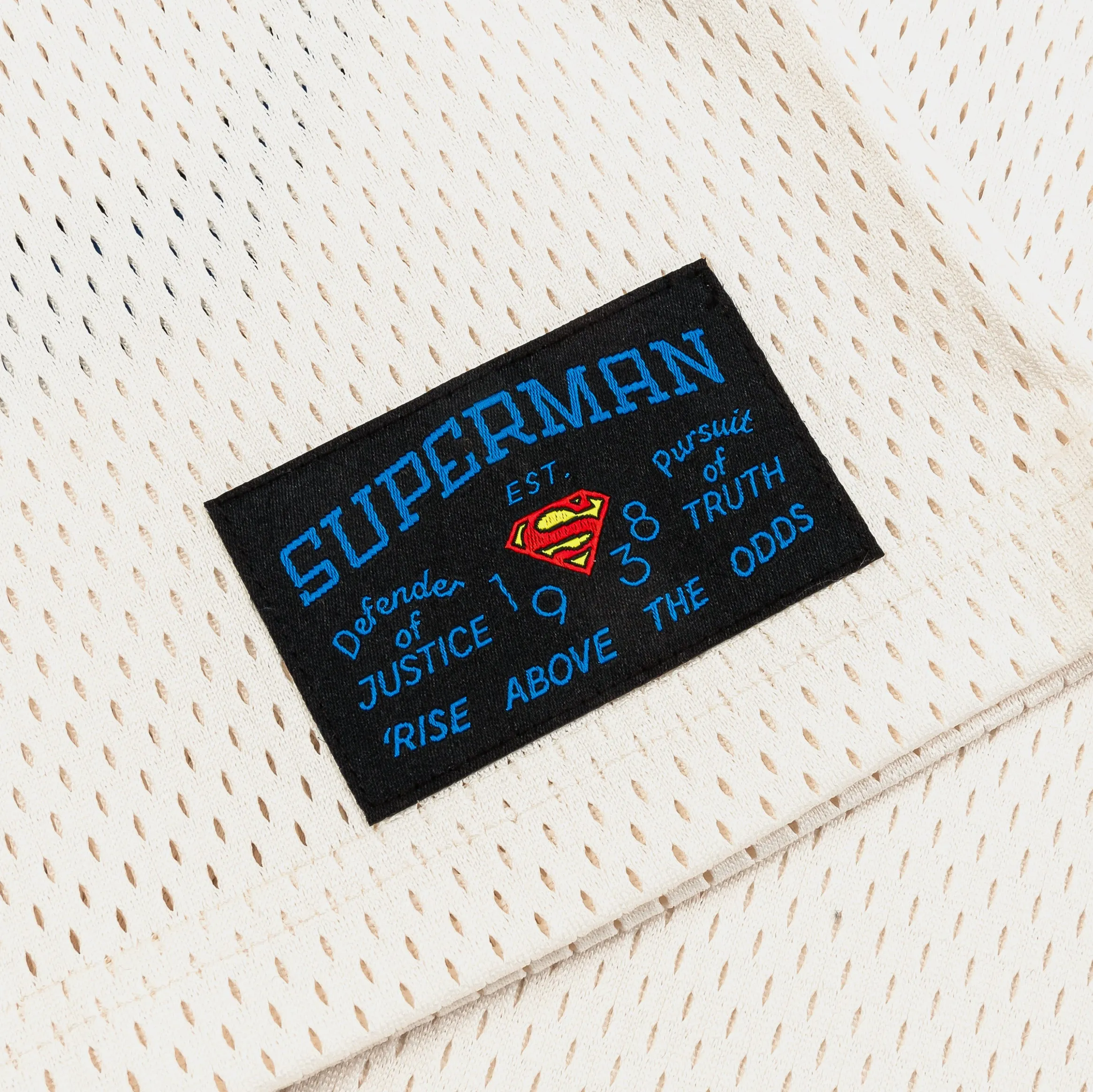 Superman x Shoe Palace 38 Mesh Mens Jersey (Beige/Red) Move Enhanced